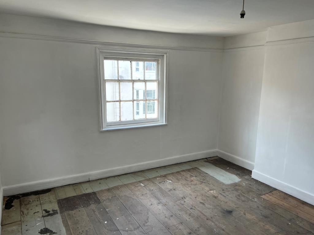 Lot: 102 - FOUR-BEDROOM TOWN CENTRE HOUSE FOR IMPROVEMENT - The Second Floor Front Bedroom Overlooking Nelson Street
